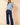 Full-length view of model wearing blue Round Neck Puff Short Sleeve Cable Sweater with blue jeans