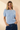 Front view of model wearing blue Round Neck Puff Short Sleeve Cable Sweater with blue jeans