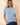 Front view of model wearing blue Round Neck Puff Short Sleeve Cable Sweater with blue jeans