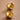 18K Gold Plated Waterproof Stainless Steel Hoop Earrings 7463 displayed as a pair on a warm brown background