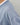 Close-up detail of  blue long sleeve top