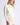 Close-up of white Chiara long-sleeve pullover sweater on model