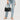 Waylon Shoulder Bag Chocolate in black displayed with a casual outfit.