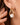 18K Gold PVD Plated Waterproof Stainless Steel Hoop Earrings 7193 worn on an ear, showing the gold design