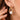 18K Gold PVD Plated Waterproof Stainless Steel Hoop Earrings 7193 worn on an ear, showing the gold design