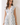 Floral Print Zipper Front Midi Dress featuring a V neckline and cap sleeves, styled with a fitted waist.