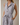 V NECK CAP SLEEVE BUTTON UP WAIST TIE BELT MIDI DRESS worn by a model with pockets and a stylish collar.