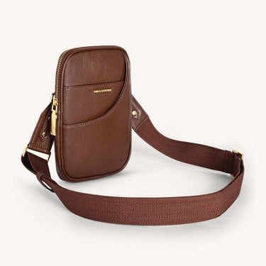 Vegan Leather Mini crossbody bag in brown with adjustable strap and gold zipper detail.