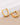 18K Gold Plated Waterproof Stainless Steel Hoop Earrings 7116 displayed as a pair on a light background