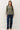Close-up of sage green raglan sleeve slub pullover sweater fabric and neckline