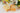 Sunset Dandelions Soap bars displayed with colorful flowers and botanical decorations