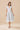 Floral Print Zipper Front Midi Dress worn by a model with a V neckline and cap sleeves on a neutral background.