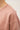 Close-up detail of pink long sleeve top fabric