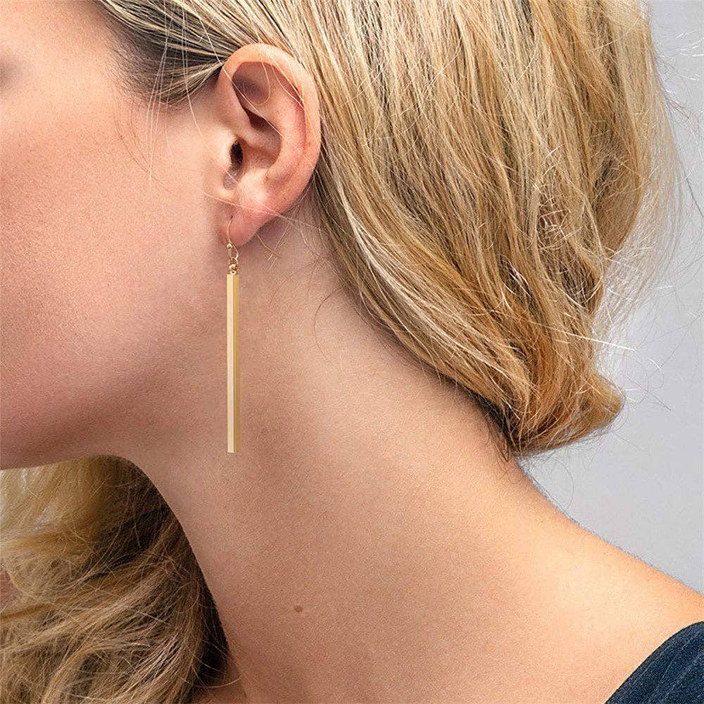 18K Gold Plated Waterproof Stainless Steel Drop Earrings 6976 worn on an ear, showing the long drop design
