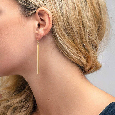18K Gold Plated Waterproof Stainless Steel Drop Earrings 6976 worn on an ear, showing the long drop design