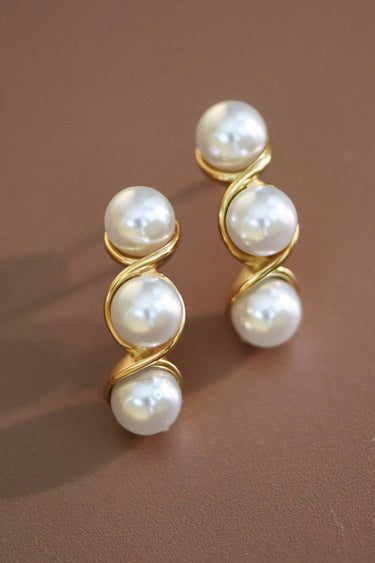 18K Gold PVD Plated Waterproof Stainless Steel Stud Earrings 7093 displayed vertically on a brown background