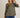 Model wearing olive green Round Neck 3-4 Sleeve Top with blue jeans
