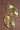 Gold Plated Metal Leaf Drop Earrings 7418 showcasing the gold finish and layered leaf details