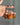 Carnelian Crystal Keychain featuring polished orange and reddish-brown gemstones displayed in a hand