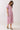 Pink Tropical Print Puff Sleeve Midi Dress on a model with puff sleeves and a V-neckline, featuring a tropical leaf design.