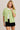 Model wearing green short sleeve sweater cardigan with black shorts