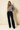 Round neck long-sleeve stripe sweater worn by a model, full length view