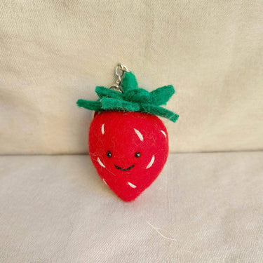 Felt Keychain Sweet Strawberry handcrafted from wool felt with smiling face and green leaf details.