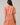Woman wearing Dixie Split Neck Shift Dress Drift Floral in org pinks multi from the back, showcasing short sleeves and tiered skirt.