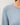 Close-up of blue slub pullover sweater fabric and raglan sleeve detail