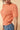 Round Neck Cable Sweater in soft orange with puff short sleeves and cable-knit texture.