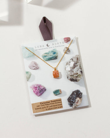Sublime Adjustable Necklace- Sunstone displayed on a card with various gemstones.
