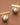18K Gold Plated Waterproof Stainless Steel Stud Earrings 7743 displayed as a pair on a brown background