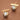 18K Gold Plated Waterproof Stainless Steel Stud Earrings 7743 displayed as a pair on a brown background