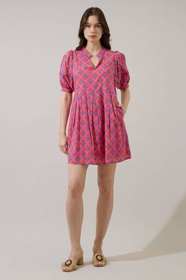 Fawna Shift Mini Dress Kendrie Floral in pink and blue with split neckline, puff sleeves, and pockets, perfect for summer outings.