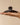 Large Arched Clip Black held in hand, showcasing eco-friendly design and durable construction.