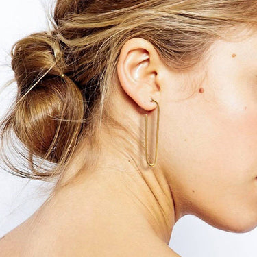 18K Gold Plated Waterproof Stainless Steel Hoop Earrings 6977 worn on an ear, showing the gold finish