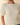 Close-up view of model wearing cream ribbed knit top