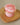 Rose Cupcake Soap single pink cupcake-shaped soap on a wooden dish