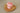 Rose Cupcake Soap single pink cupcake-shaped soap on a wooden dish