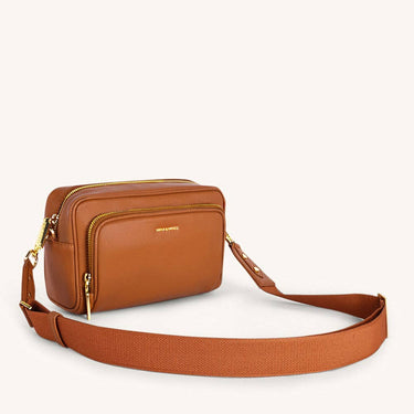 Mira & Moss Lucienne Crossbody Bag in brown vegan leather with adjustable strap and dual compartments.