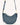 Mira & Moss Sabine Crescent Crossbody Bag in blue vegan leather with gold-tone hardware and adjustable strap.