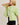 Side view of model wearing green short sleeve sweater cardigan