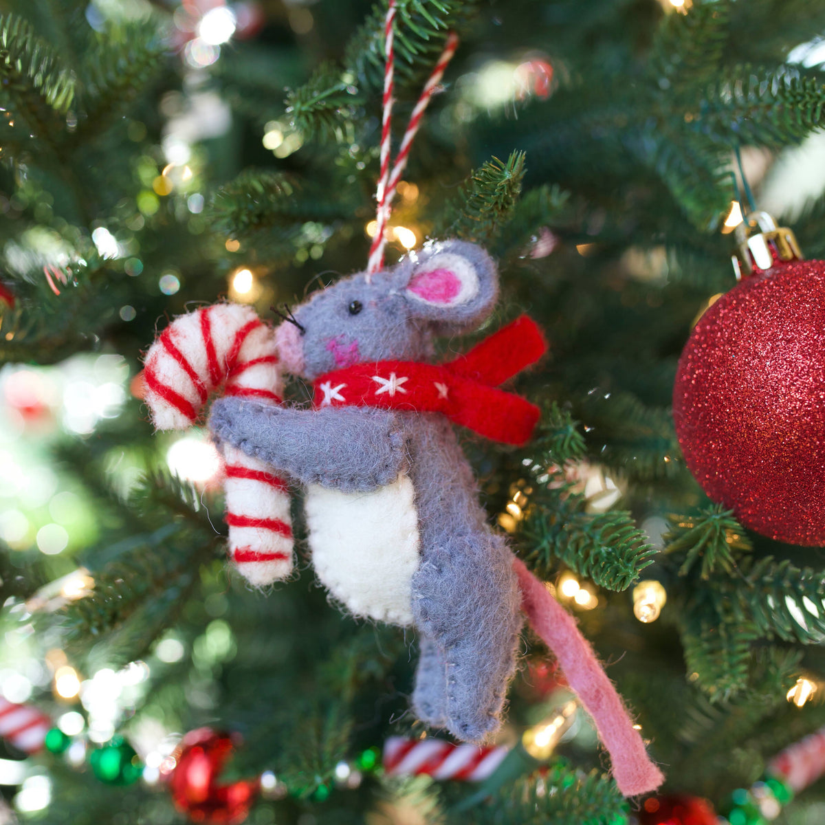 Mouse with Candy Cane Felt Wool Christmas Ornament displayed on greenery