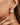 18K Gold Plated Waterproof Stainless Steel Hoop Earrings 7101 worn on an ear