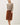 Full length view of model wearing purple [NEW COLOR] Ribbed Crewneck Cardigan in beige