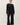 Full-length view of model wearing black short sleeve top with black pants