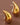 18K Gold Plated Waterproof Stainless Steel Stud Earrings 7080 displayed as a pair on a brown background