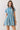 Blue Stripe Button Down Shirt Mini Dress on a model showcasing its collared design and cinched waist.