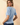 Back view of model wearing blue Round Neck Puff Short Sleeve Cable Sweater with blue jeans