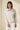 Model wearing beige melange Half Zip Funnel Neck Long Sleeve Pullover Top